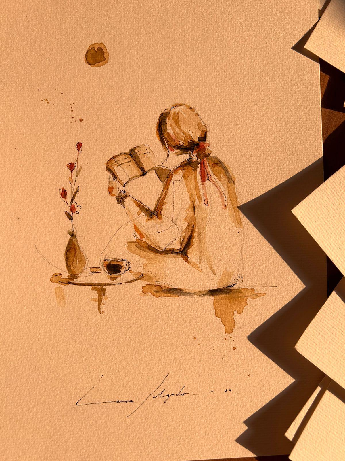 Obra em aquarela e café